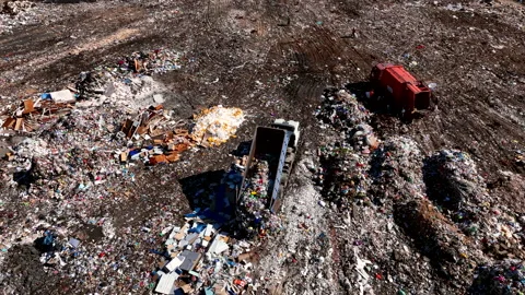 Landfill with solid household waste. Garbage truck unloads rubbish Stock-Footage 211468811