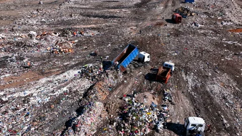 Landfill with solid household waste. Garbage truck unloads rubbish Stock-Footage 212013488