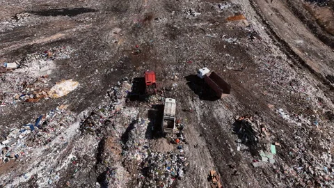 Landfill with solid household waste. Garbage truck unloads rubbish. Stock Footage 212052280