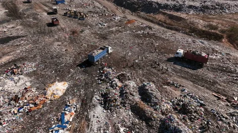 Landfill with solid household waste. Garbage truck unloads rubbish. 库存影片 212122293