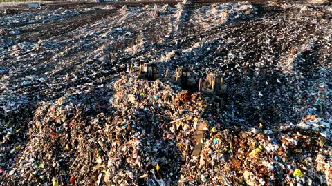 Landfill with solid household waste. Garbage dump with plastic and polyethylene. Video stock 219833880