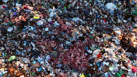 Landfill with solid household waste. Garbage dump with plastic and polyethylene. Stock Footage 219895283