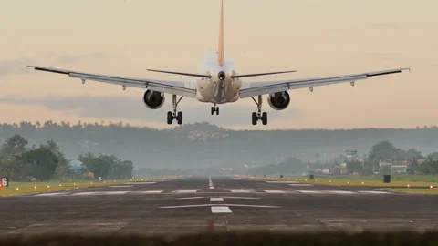 Landing aircraft at the airport of the city of Legazpi early in the morning Stock Footage