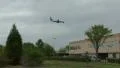Landing Airliner Over Office Building HD Footage