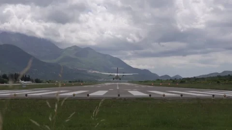 Landing an airplane in difficult conditions among the mountains Stock Footage 132631653