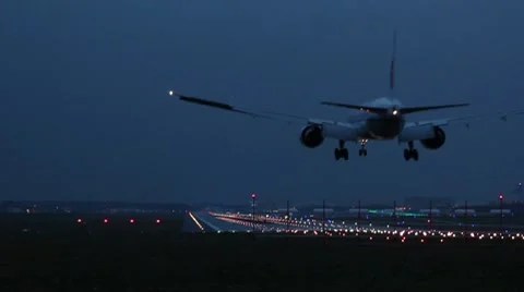 Landing airplane at dusk Stock Footage 8919014