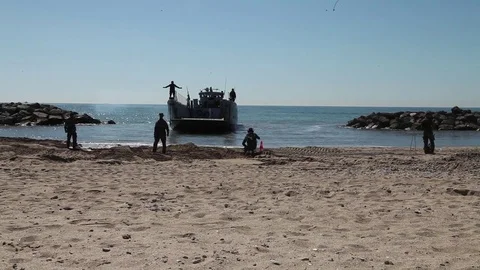 Landing craft arrives on beech Stock-Footage 76216511