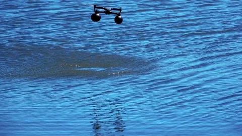 Landing of the drone quadrocopter on the water Video stock 76169749