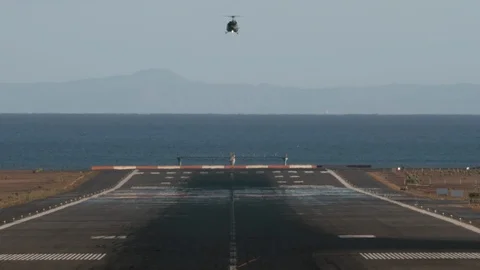 A landing helicopter 스톡 동영상 115084844