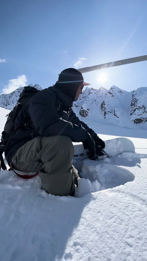LANDING A HELICOPTER IN THE SNOW Stock Footage 249123948