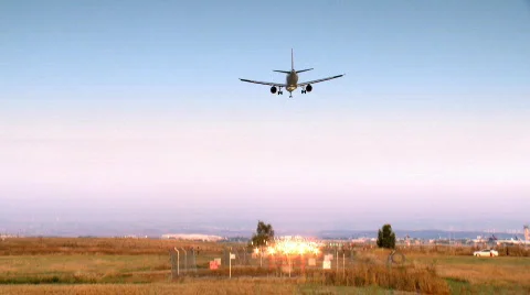 Landing of a jet plane - evening time 2 Stock Footage 729422