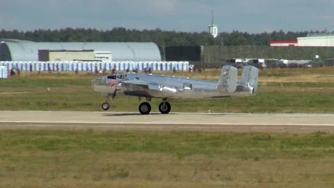 Landing of North American Mitchell B-25 bomber on concrete runway. Stock Footage 120778693