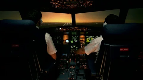 Landing of passenger plane. Sunset view from the cabin of modern plane to the Vidéo 77335976