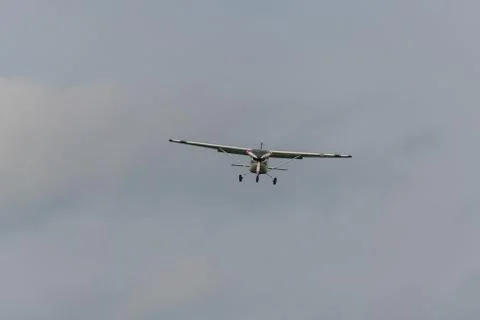 A landing  plane on a gray background Stock Photos