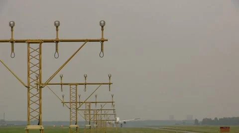 Landing plane with lampposts in the front Stock Footage 8552200