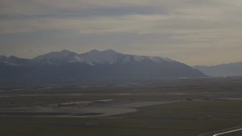 Landing Plane Next To Mountains Stock Footage 117054589