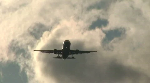 Landing plane at sunset 5 Stock Footage 87939