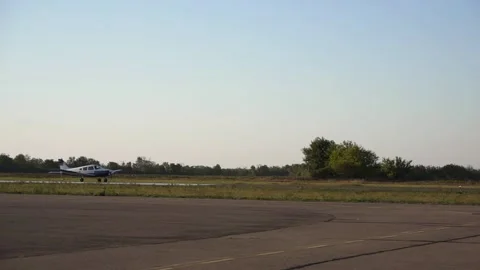 Landing. A small plane is fast on the runway of the airport. Navigation of the Stock Footage 154109920