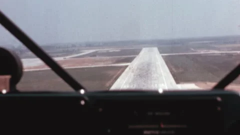 Landing of a small propeller plane from the pilot's point of view in the 1950s Stock Footage 168888330