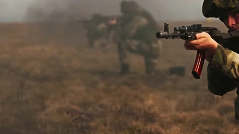 Landing special forces troops from a helicopter. A soldier shoots on the Stock Footage 173128665