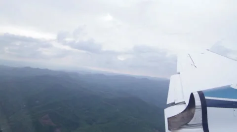 Landscape and Clouds from a private jet right after takeoff Stock Footage 38523697