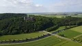 Landscape and neo-gothic Marienburg castle aerial on sunny forest mountain 4k 4k or 4k+ Resolution
