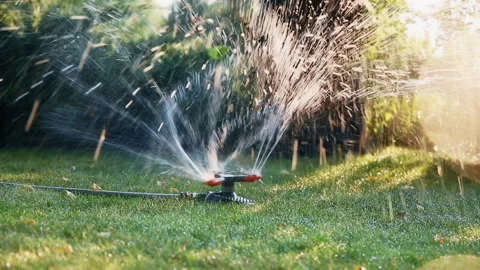 Landscape automatic garden watering system with different rotating sprinklers Stock Footage 148582056