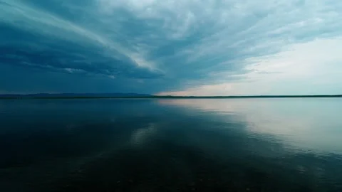 Landscape background on a lake where a thunderstorm front is forming. Video stock 315737156