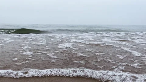 Landscape on the beach slow motion foamy waves rolling towards white sand beach Stock Footage 183608306