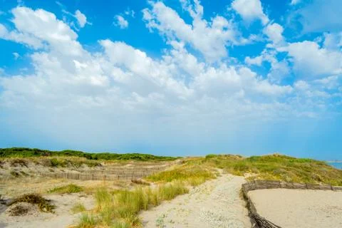 Landscape of beach under cloudy sky Stock Photos