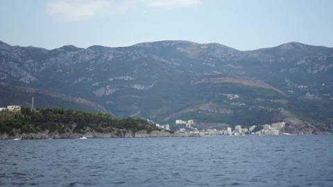 Landscape of the beautiful sea coast with cliffs, high mountains and little Stock Footage 85642469