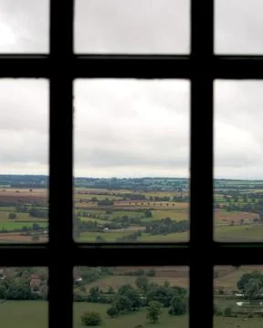 Landscape behind castle window Stock Photos