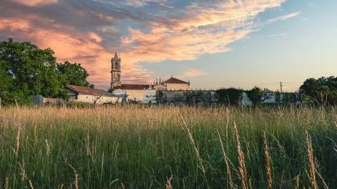 Landscape with bell tower Stock Photos
