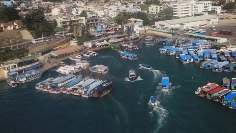 Landscape from bird view of Cargo ships entering one of the busiest ports in the Stock-Footage 124580245
