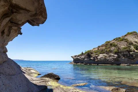 Landscape of the bizarre white rocks and the blue sea of ??the Sardinian coas Stock Photos