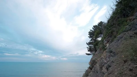 Landscape of blue sky with cirrus clouds near shore with greens. Stock Footage 80066704