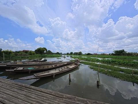 Landscape blue sky clouds river boat green trees, countryside . Stock Photos