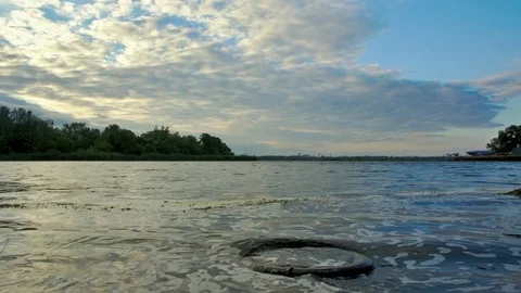 Landscape with a car wheel in the water Stock-Footage 76566468