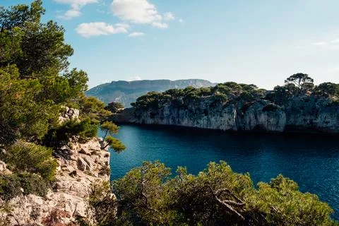 Landscape of cliffs and pine trees of the rocky inlets in the Mediterranean.. Stock Photos