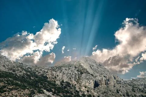 Landscape with clouds and sunlight over the mountains Stock Photos