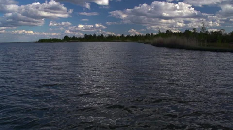The landscape with clouds over lake. Slow motion Stock Footage 54896304