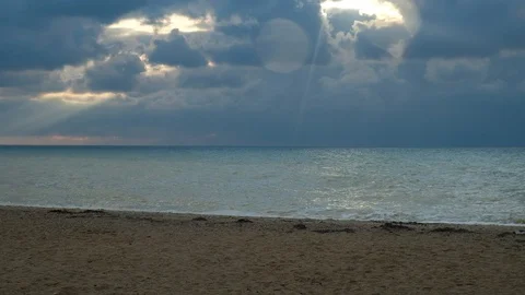 Landscape with cloudy dramatic sky, sea waves and sand beach. Stock Footage 116331481