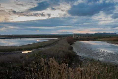 Landscape of cloudy sunset over the salt-panes. Stock Photos