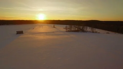 Landscape with crop fields covered by snow in winter during sunset Stock Footage 88204965