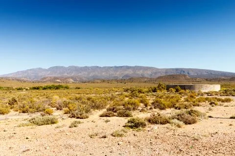 Landscape with a dam in the foreground. Stock Photos