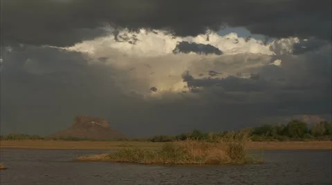 Landscape of dark clouds over water. Niassa Reserve, Mozambique. Stock Footage 23843626