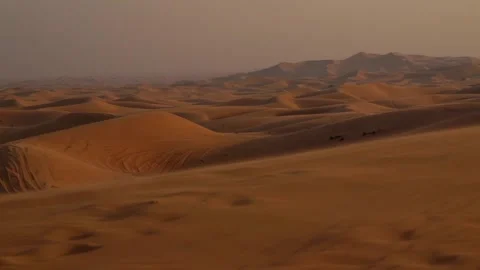 Landscape of desert dunes at sunset on a windy day Video stock 151328516