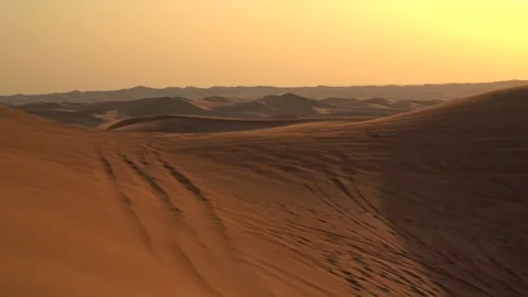 Landscape of desert dunes at sunset on a windy day Stock Footage 151328545