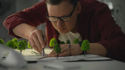 A landscape design worker is developing a project for landscaping a resident Video stock 270429060