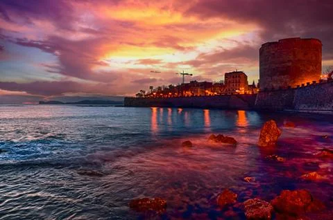 Landscape with dramatic cloudy sky of city of Alghero, Sardinia.tif Stock Photos